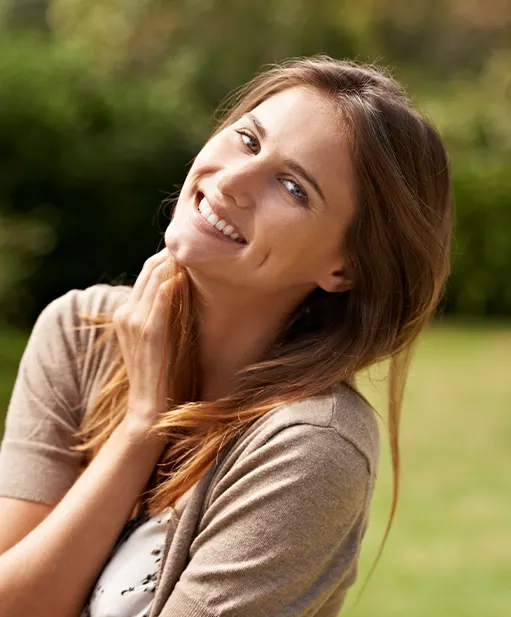 Woman smiling in a garden
